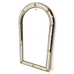 Gilt arched framed cushion mirror