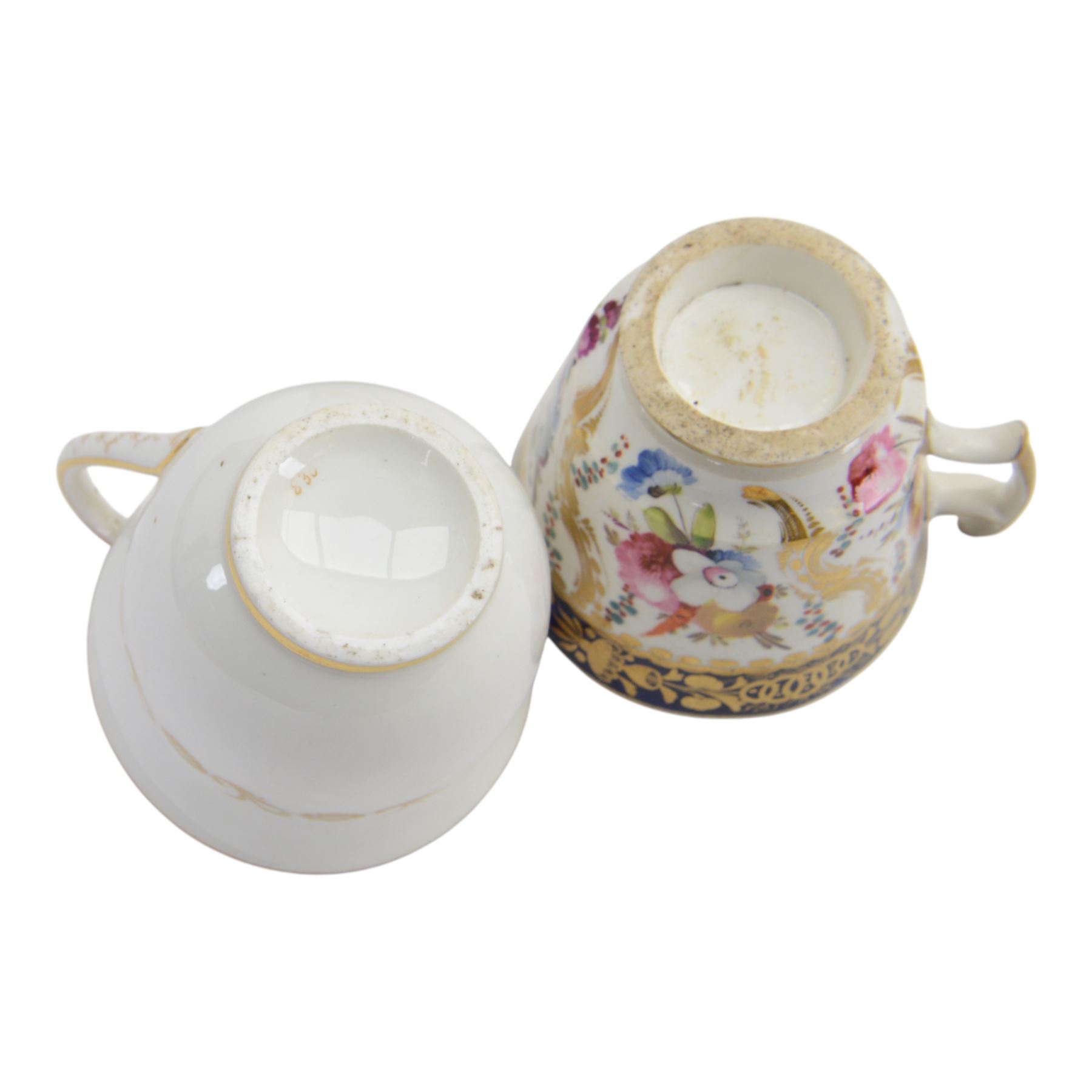 Coalport teawares, circa 1820-1840, comprising set of four trios, coffee cups, teacups and saucers, and slop bowl, decorated in the 830 pattern, with floral sprays and gilt shaped reserves, two further coffee cups and saucers, decorated with floral sprays upon blue grounds/with blue borders, and a similar coffee cup