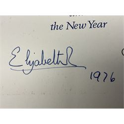 H.M. Queen Elizabeth II and H.R.H. The Duke of Edinburgh, signed 1976 Christmas card with twin gilt Royal cyphers to cover, colour photographic print of the Royal Family to interior, and signatures Elizabeth R and Philip with the manuscript date 1976 below