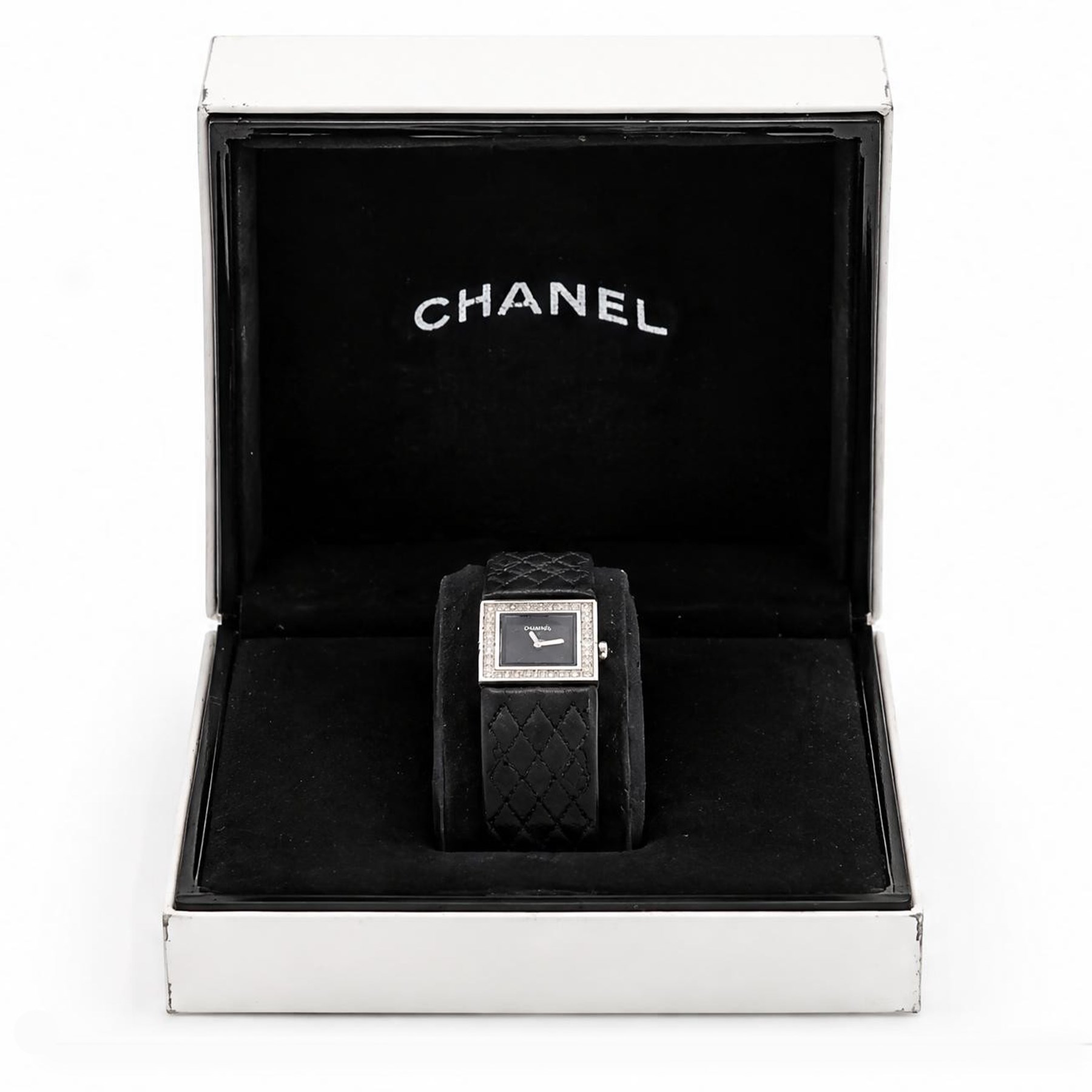 Chanel Matelassé ladies diamond stainless steel quartz wristwatch, black quilted dial, with round brilliant cut diamond bezel, back case No. 77835 and dated 2003, on quilted leather strap with fold-over-clasp 