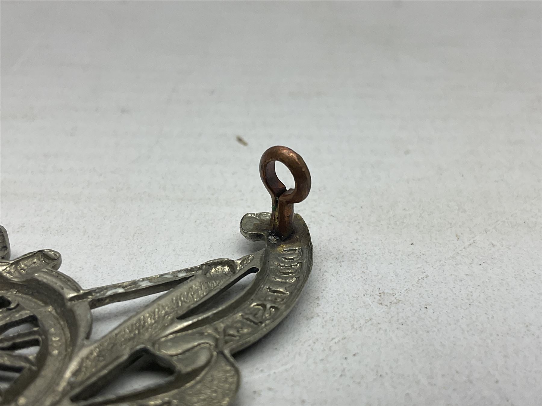 Third Middlesex Royal Garrison Artillery Volunteers Cap Badge, white meta Royal Artillery cap badge with “THIRD” to the top scroll and lower three part scroll “MIDDLESEX – R.G.A. – VOLUNTEERS”. Three lug fittings to the reverse.
