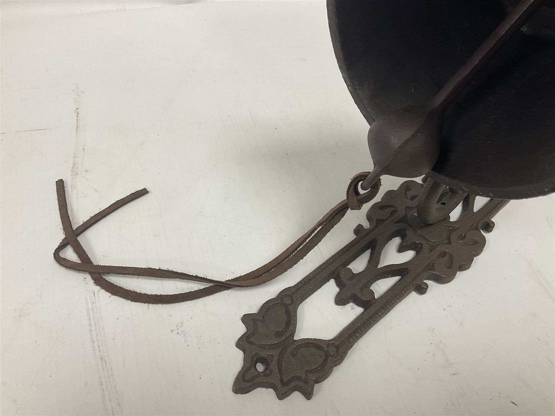 Cast iron exterior hanging garden bell with decorative butterfly bracket
