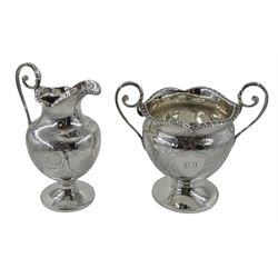 Victorian silver sugar bowl by Henry Bourne, Birmingham 1898 and a silver milk jug, London 1884, both with bright cut decoration, approx 6.9oz