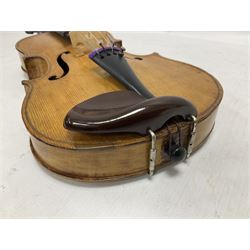 Copy of a full size Stradivarius violin, with an ebonised fretboard, tailpiece and tuning pegs, with a polished chin rest  Length 60cm