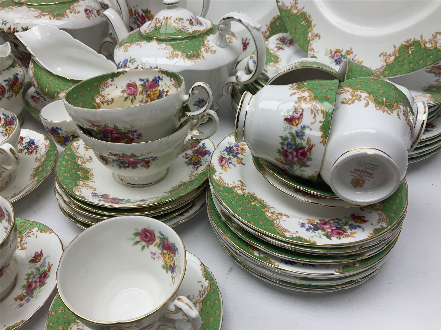 Paragon Rockingham pattern part tea and dinner service including three teapots, milk jug, cups and saucers of various sizes, ten soup bowls, ten side plates, ten dinner plates etc (96)