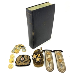 WW2 Kreigsmarine uniform accessories from prisoner of war U-boat Kapitanleutnant Gunther Lorenz comprising cap badge, pair of epaulettes, thirteen buttons marked 1940 and roll of rank braiding and stars; together with copy of Adolf Hitler's Mein Kampf. 1936 published by Zentralverlag Der NSDAP Munchen with German text.