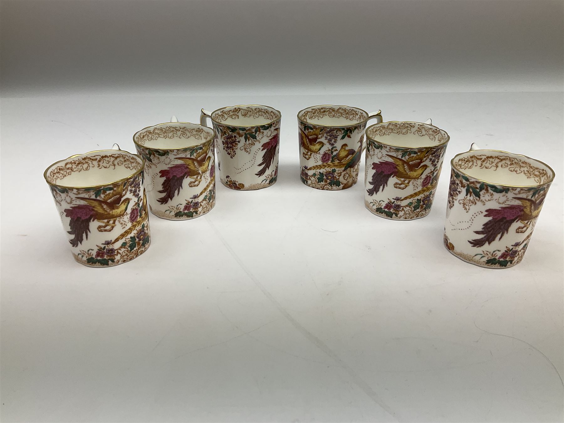 Royal Crown Derby Olde Avesbury pattern dinner and coffee service for six place settings, decorated with exotic birds amidst blossoming branches, comprising six dinner plates, six dessert plates, two tureen and covers, sauce boat and stand, oval serving platter, coffee pot, six coffee cans and six saucers, cream jug, and open sucrier, each with printed mark beneath