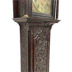 18th-century profusely carved oak longcase clock - with a pagoda pediment, upstands and carving, 
 break arch hood door flanked by reeded pilasters with brass capitals, trunk with canted corners and a spire topped door, square plinth with applied skirting, break arch brass dial with wheatsheaf engraving and cast cherub and crown spandrels, engraved break arch with the London clockmakers name John Gordin, silvered chapter ring with Roman numerals, five minute Arabic's, minute and quarter hour tracks, matted dial centre with ringed winding holes, square date aperture and seconds ring, dial pinned to a five pillar movement with inside countwheel striking, striking the hours on a cast bell. With weights and pendulum. John Gordin, is possibly a mis-spelling or phonetic spelling of John Gordon, of London, who worked from Ludgate Street in the parish of St. Gregory by St. Pauls. Apprenticed in 1689 and died in 1732 when his will was proven.
