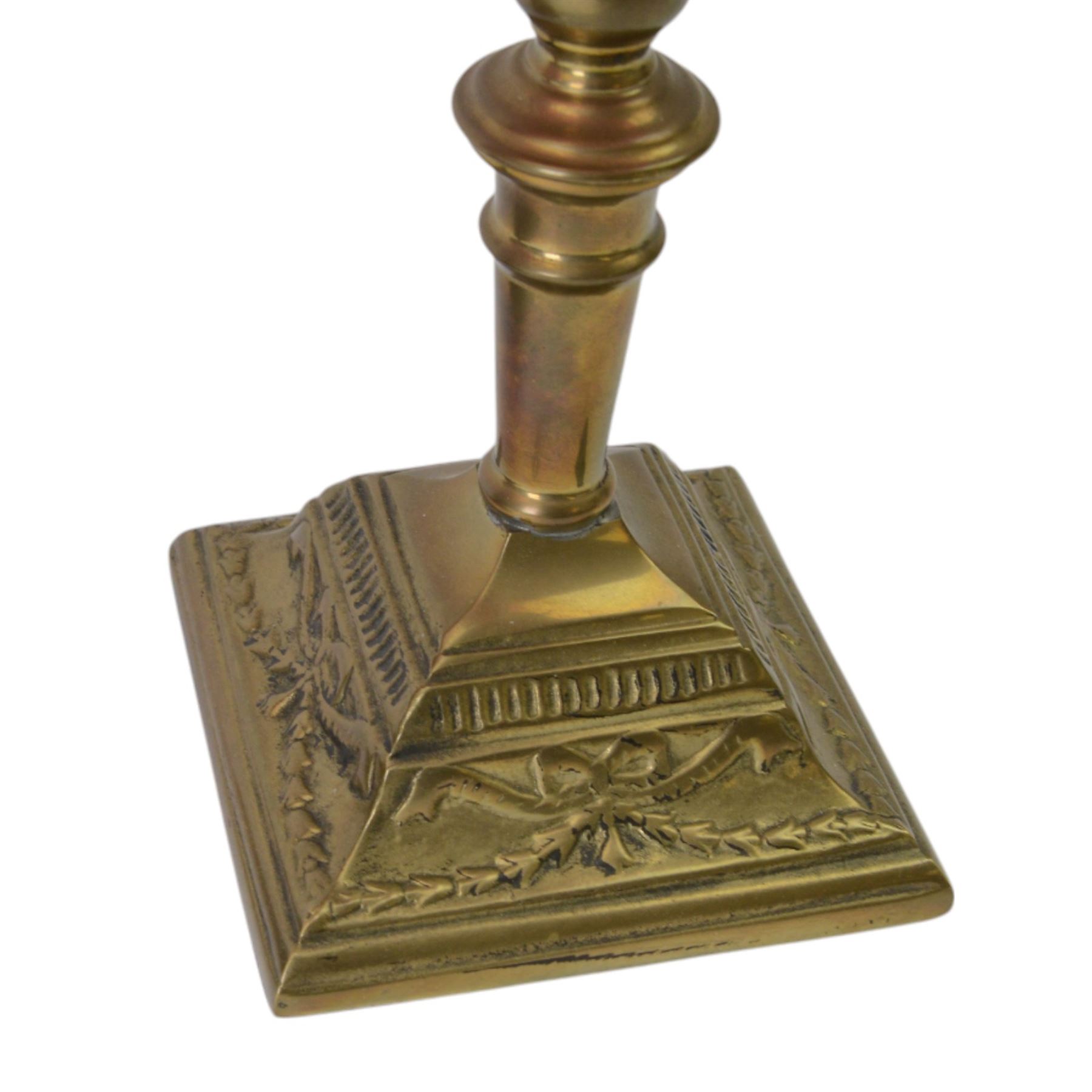 Pair of cranberry glass and brass oil lamps, with frilled graduated cranberry glass shade, cranberry reservoir with brass Gaudard burner, upon knopped column  with stepped square base, H46cm