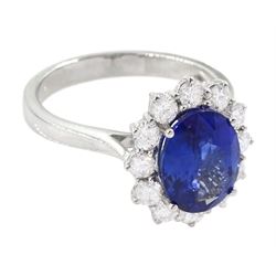 18ct white gold oval cut sapphire and round brilliant cut diamond cluster ring, hallmarked, sapphire approx 3.85 carat