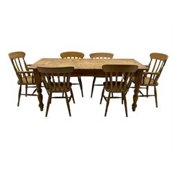 Pine farmhouse dining table, rectangular top with rounded corners, raised on turned supports; together with a set of six (4+2) spindle-back dining chairs