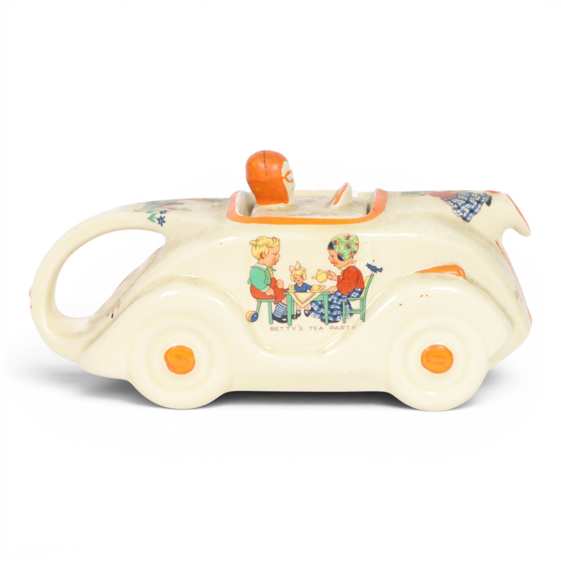 Sadler Art Deco teapot, modelled as a racing car with printed designs in the manner of Mabel Lucie Attwell, H10cm, L23cm