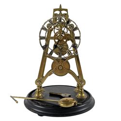 Brass skeleton clock, the single fusee movement with silvered Roman numeral dial, upon an ...