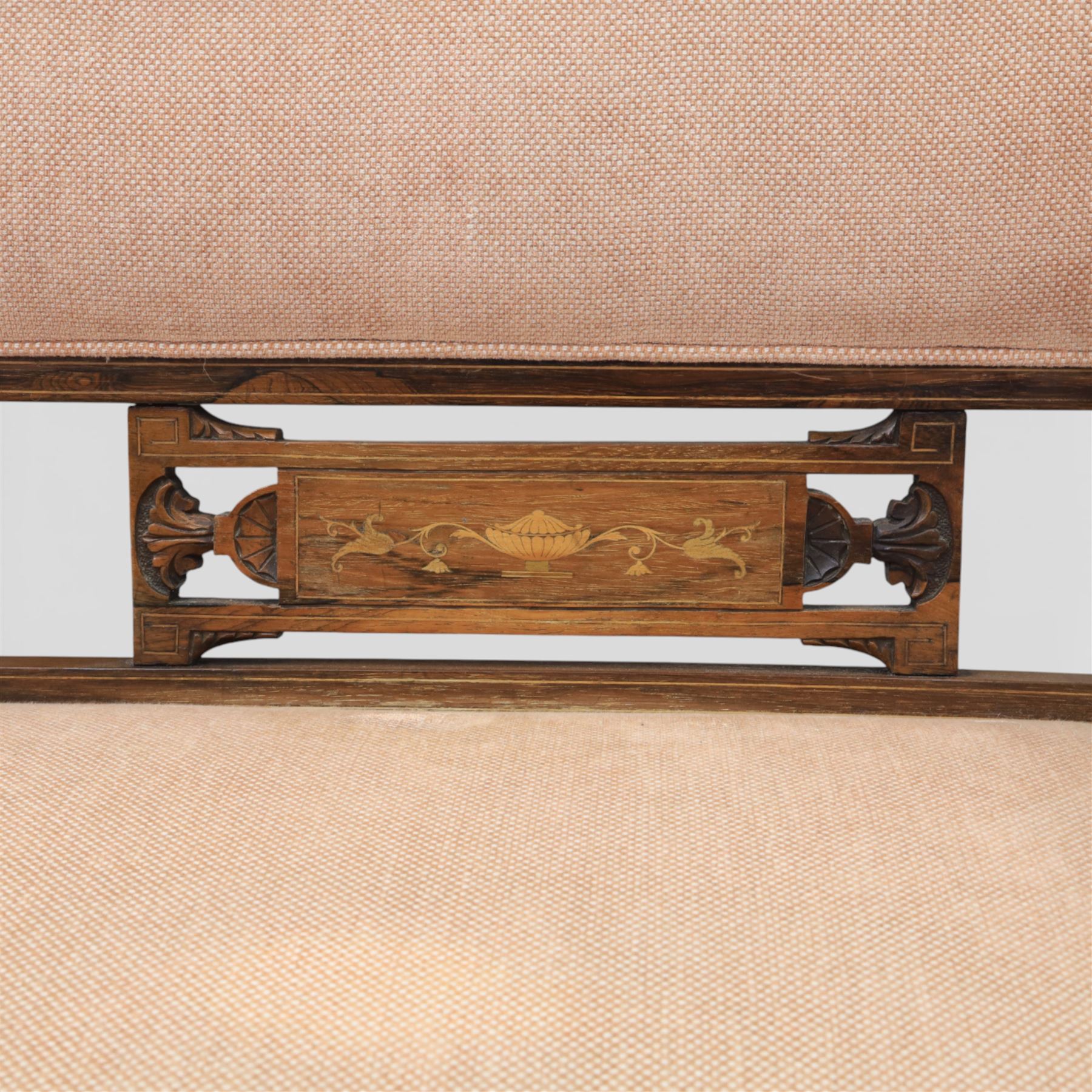 Quality Edwardian seven piece inlaid salon suite, comprising three seater settee, pair of arm chairs and four chairs with pierced splat backs, upholstered in pale pink fabric, inlaid with flowering urns, upon tapering legs with spade feet and castors