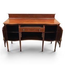 Edwardian mahogany and satinwood sideboard, shaped top with galleried back, with freize drawer flanked by two cabinets, united by undertier, raised on square tapering supports terminating in spade feet
