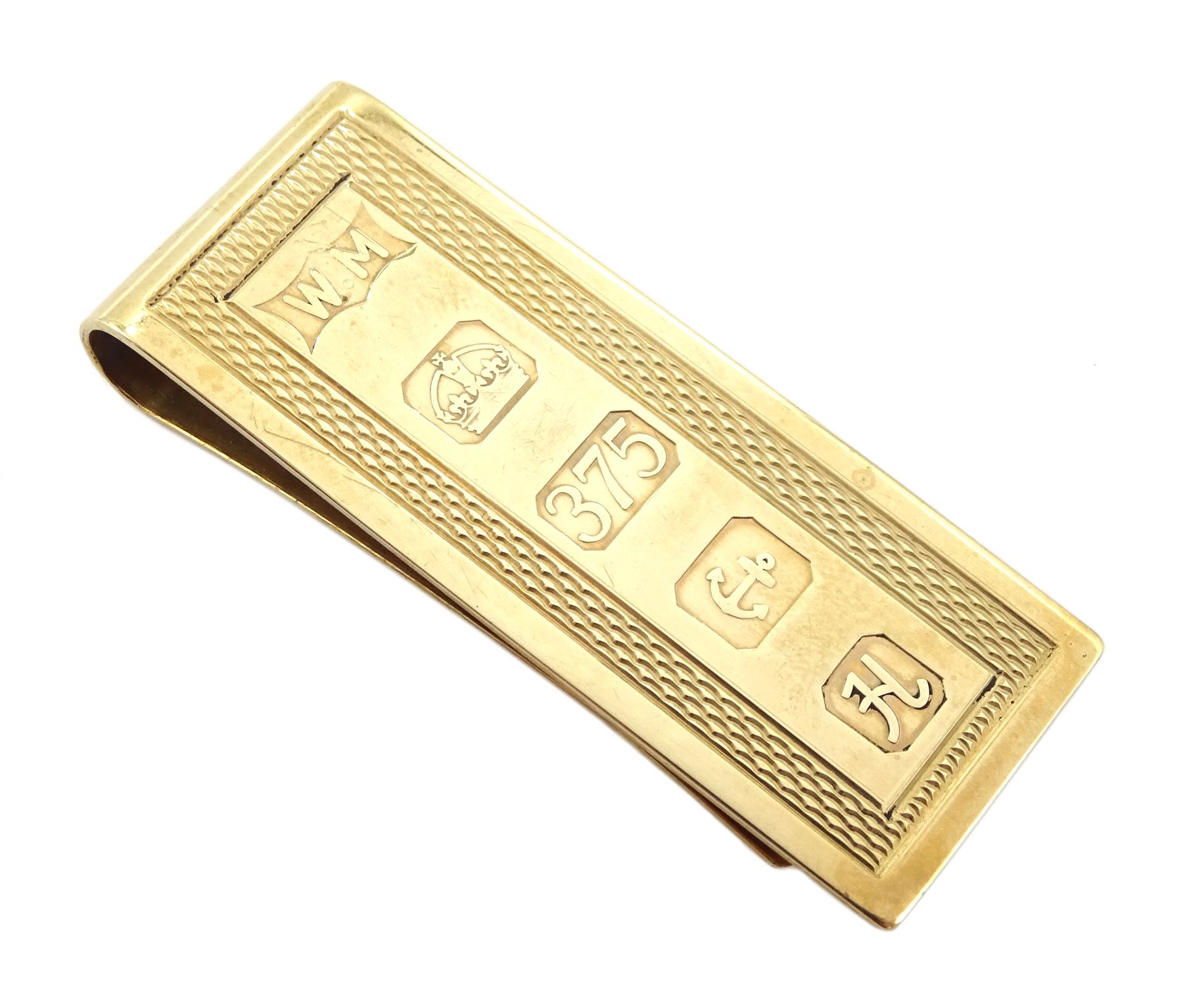9ct gold money clip, engine turned decoration by William H Manton, Birmingham 1982, approx 15.34gm