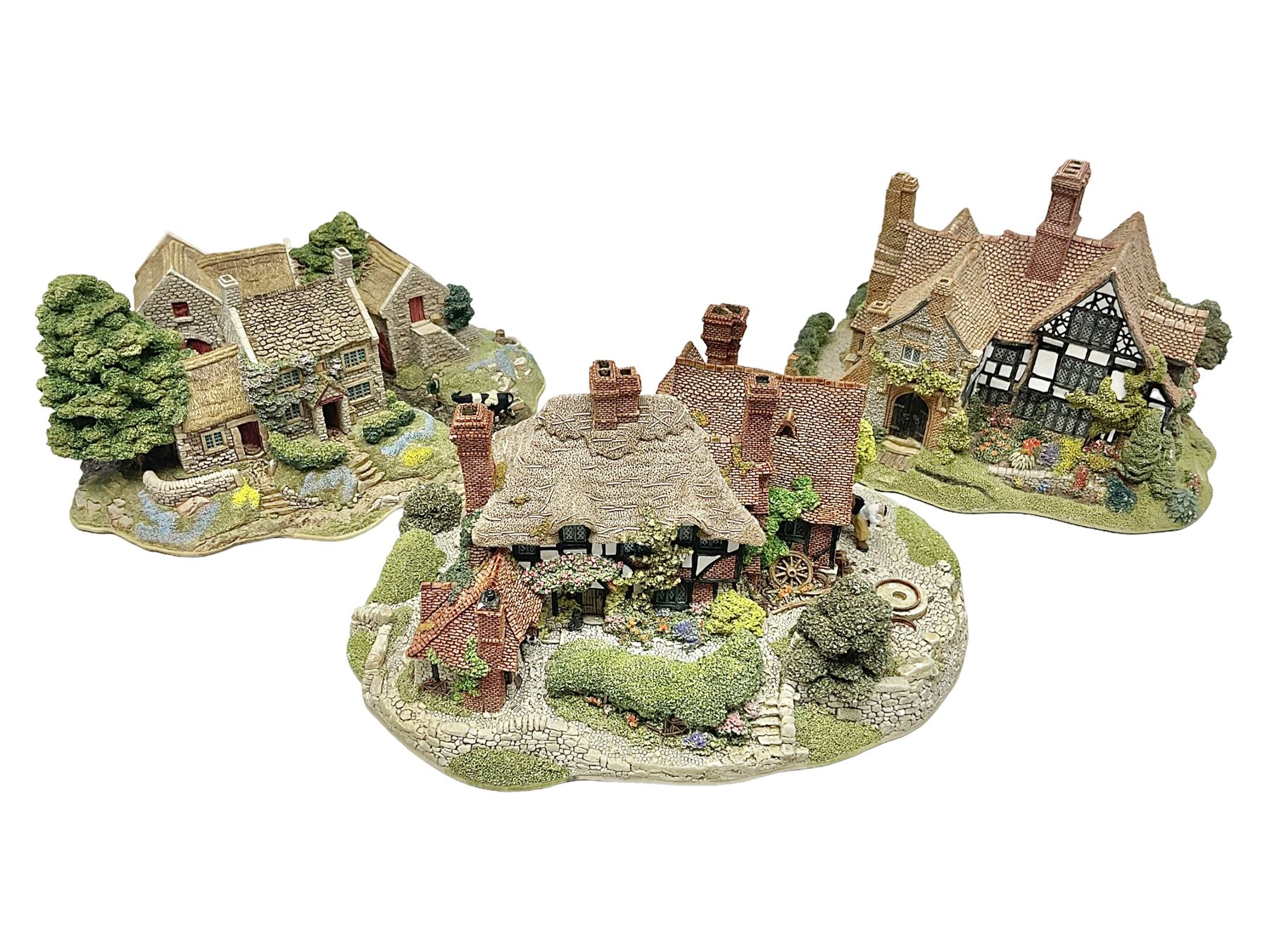 Three Lilliput lanes, comprising Oakwood Smithy, Anne of Cleves and Bluebell Farm, all with deeds and original boxes 