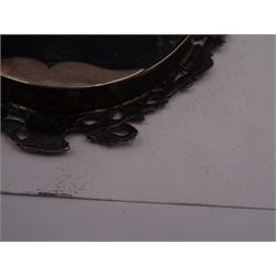 Continental silver miniature dressing table/wall mirror, of oval form with bevelled mirror plate, surrounded by a bead and dart rim, with pierced scrolling floral border with a standing cavalier to either side and the bust of a cavalier to the base, H17.7cm
