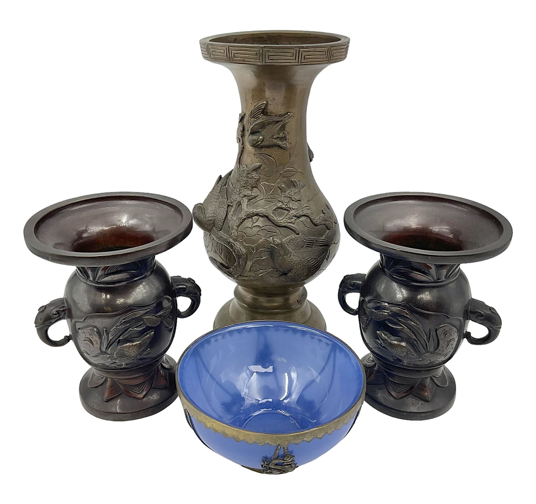 Chinese bronze vase, of baluster form with elongated neck, decorated in relief with birds amongst prunus blossom, together with a smaller pair of twin handled bronzed vases, decorated with peacocks and a blue Peking glass dish, with white metal mounted decorated with dragons, bronze vase H23.3cm