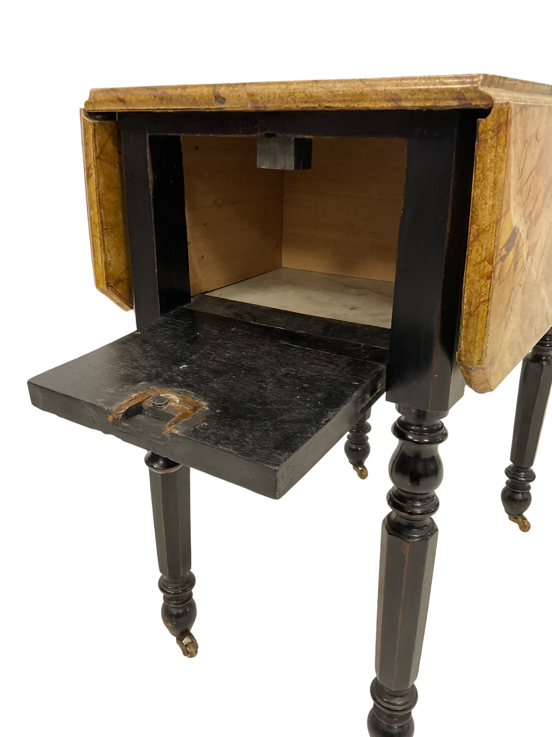 Victorian ebonised drop-leaf pot cupboard with later trompe l'oeil painted top, depicting marbled surface with baize cloth, playing cards and pencil, fitted with two drawers to one end and cupboard to the other with marble inset, on turned and faceted supports with brass castors