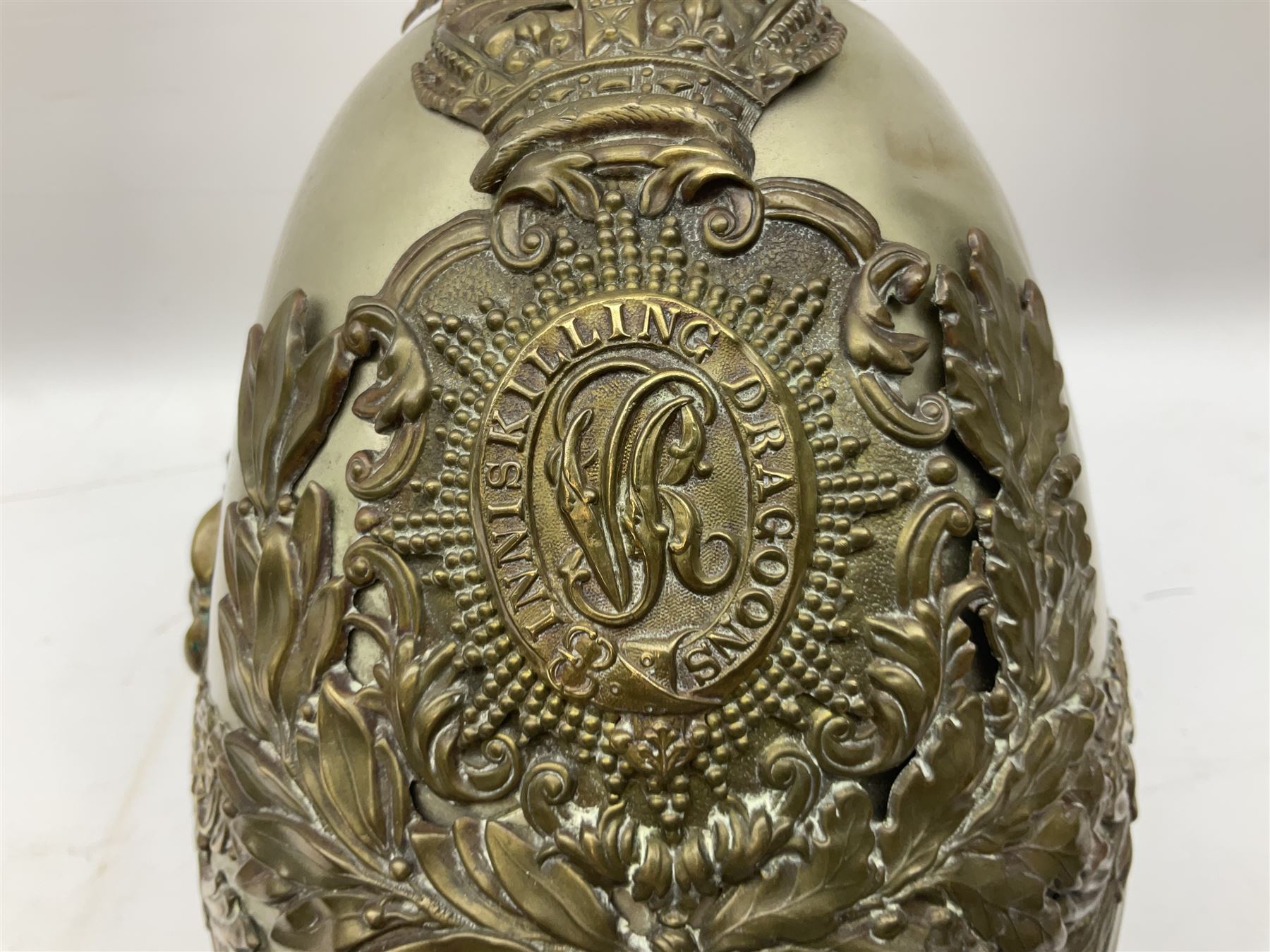 Victorian 1847 Pattern Officer's Helmet of the Inniskilling Dragoons, the white metal skull with gilt fittings including VR cypher to the plate; with leather liner H24cm