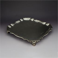 1920s silver waiter, of octagonal form with piecrust rim, upon four Art Nouveau style feet...