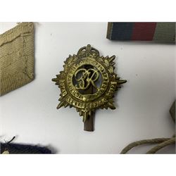 WWII group of three medals comprising 1939-45 War Medal and Italy and Africa Stars in issue box; dog tags for 282894 W. Wilkinson with framed photograph in uniform; and small quantity of cloth and metal badges including RAOC cap badge