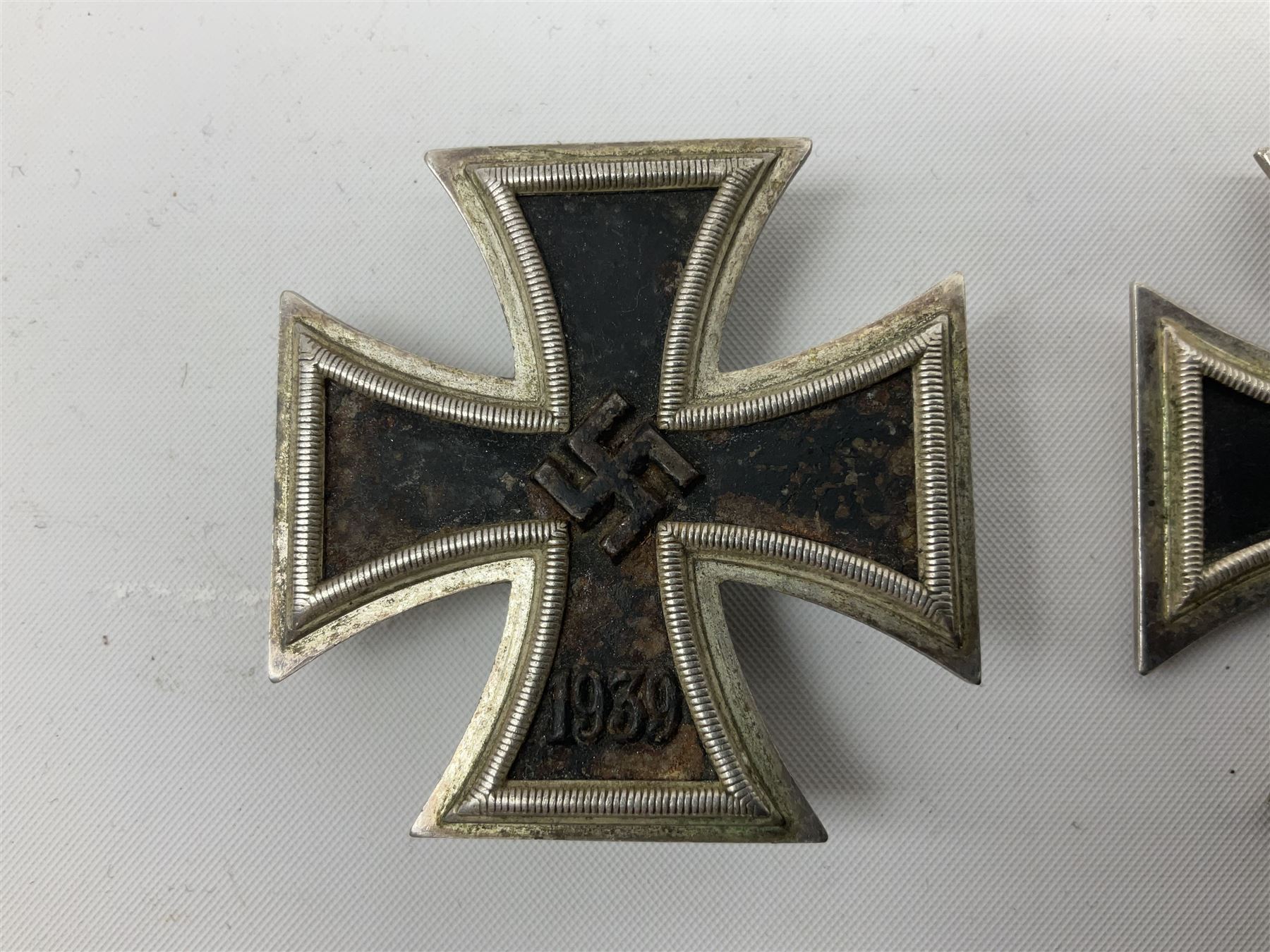WW2 German Iron Cross 1st Class, back of pin indistinctly stamped ?20; and WW2 German Iron Cross 2nd Class, ring indistinctly stamped ?100 for Rudolf Wachtler und Lange (2)