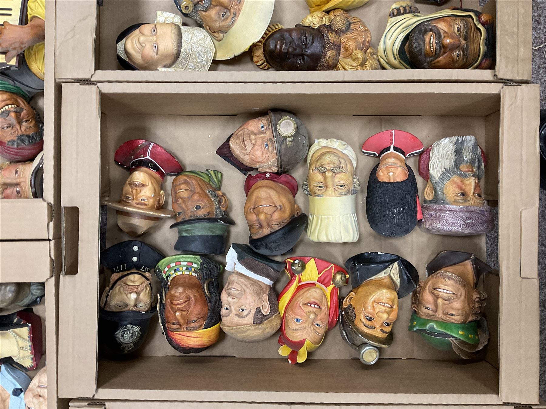 Large collection of Bossons plaster wall-masks, including including fisher man, policeman, highway man, etc, in four boxes 