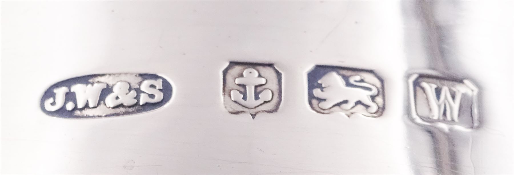 1920's silver twin handled bowl, of circular form with girdle and twin flying scroll handles, upon a spreading circular foot, hallmarked James Woods & Sons, Birmingham 1921, including handles H9cm bowl D10.5cm, approximate weight 4.34 ozt (134.9 grams)