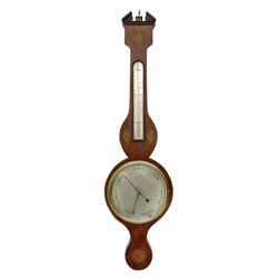 Early 19th century William IV mercury wheel barometer with a rosette inlaid broken pediment and correspondingly inlaid round base, mahogany veneered case with inlaid oval conch shell paterae and satinwood stringing to the edge, with an arched thermometer box and spirit thermometer measuring degrees Fahrenheit from 20 to 120, eight-inch silvered register reading barometric pressure in inches from 28  to 31, with predictions in Roman upper and lower case and script, dial inscribed “A Tagliabue,24 Grenville Street, Luther Lane, London”, with a steel indicating hand, brass recording hand and cast brass bezel.