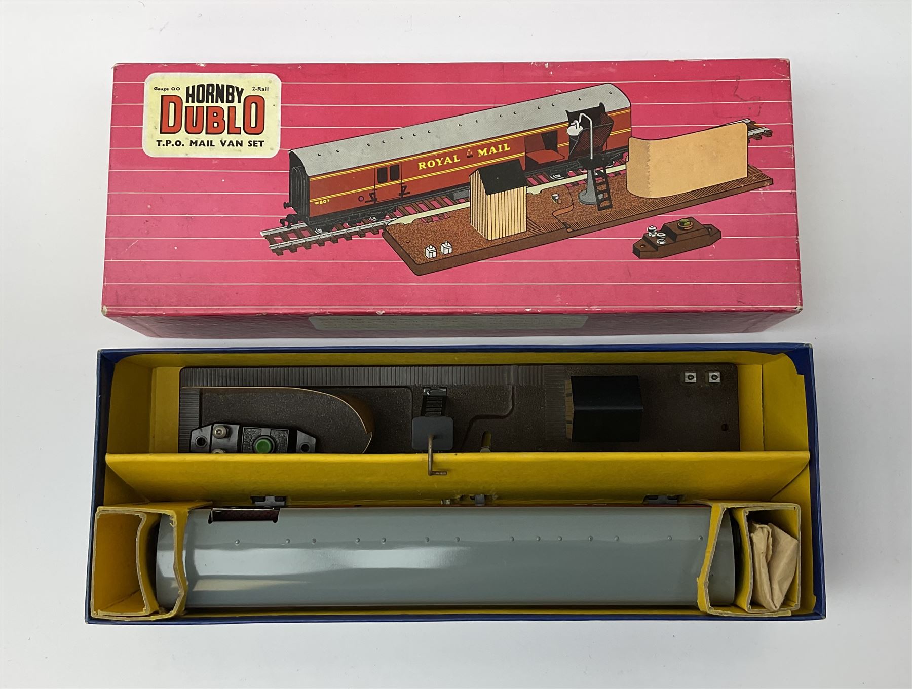 Hornby Dublo - 5080 Signal Cabin with pack of Station Names; two D1 Footbridges, one with instructions; and two 2460 Plastic Level Crossings suitable for two-rail system; 2400 T.P.O. Mail Van Set for two-rail system all boxed; together with three plastic brick effect tunnel mouths for double track layout (9)