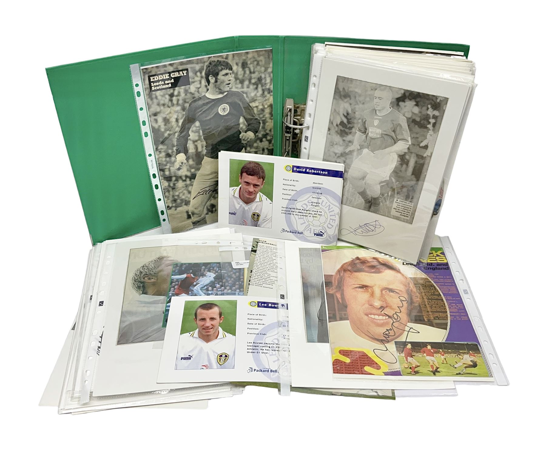 Collection of approximately 200 Leeds United related autographs, predominantly signed newspaper cuttings, contained within ring binder, together with a number of loose examples