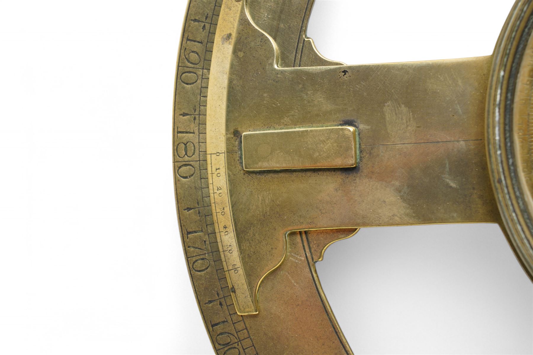 Ihon (John) Coggs of Fleet Street, London,- George II brass circumferentor (theodolite) c1730, housing a cylindrical glazed compass with a steel  indicating hand and engraved (formerly silvered) eight point compass rose to the centre, outer track divided into two-degree intervals and a subsidiary Arabic numeral chapter ring divided into ten minute intervals, mounted on a 12