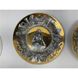Three Fornasetti plates from the Melodramma series, each depicting a operatic portraits within a border of operatic emblems on gilt ground, with printed mark beneath, D25cm 