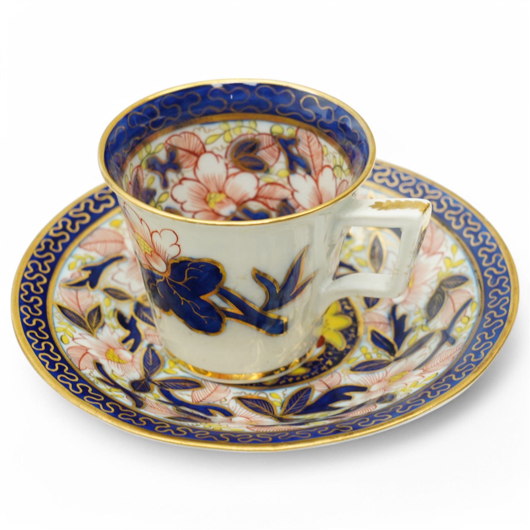 English porcelain Imari tea and coffee wares, pattern 1277, decorated with central orange floral motif surrounded by sprigs of yellow foliage within blue borders, comprising eleven teacups, eight coffee cups, twelve saucers, two shallow bowls and one finger bowl