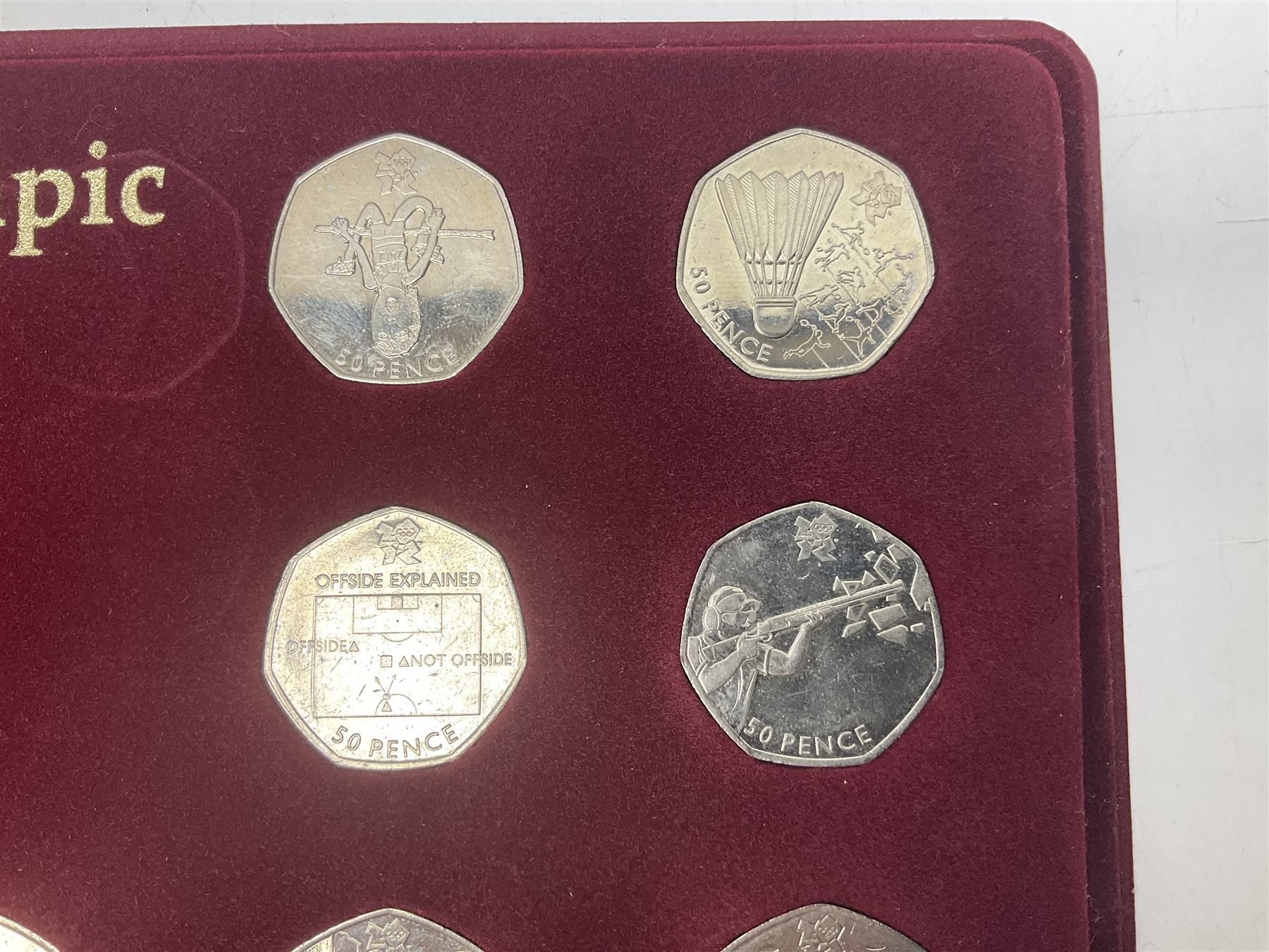 Queen Elizabeth II United Kingdom London 2012 Olympic commemorative fifty pence collection comprising twenty-nine coins and completer medallion, housed in unofficial display case