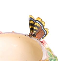 Delphin Messier (1836-1907), glazed earthenware cache-pot, decorated with three butterflies surrounded by floral and foliate motifs. upon a pink circular foot, signed beneath, H24cm