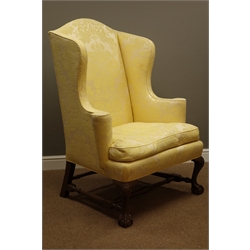  Large pair 'Kittinger Company' Georgian style outsplayed wingback armchairs on shell carved cabriole legs with ball and claw feet jointed by turned stretchers, arms feather seat cushion upholstered in pale lemon Damask fabric  