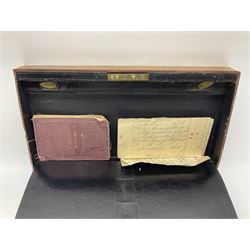19th century apothecary leather carrying case, with key, the hinged lid opening to reveal seventeen glass medicine bottles with stoppers, most with chemist labels, gram scales, and domestic medicines booklet, H9cm, L27cm
