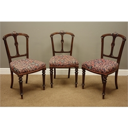  Three Victorian walnut chairs with carved detail and upholstered seats, an Edwardian inlaid nursing chair and an early 20th century stool  