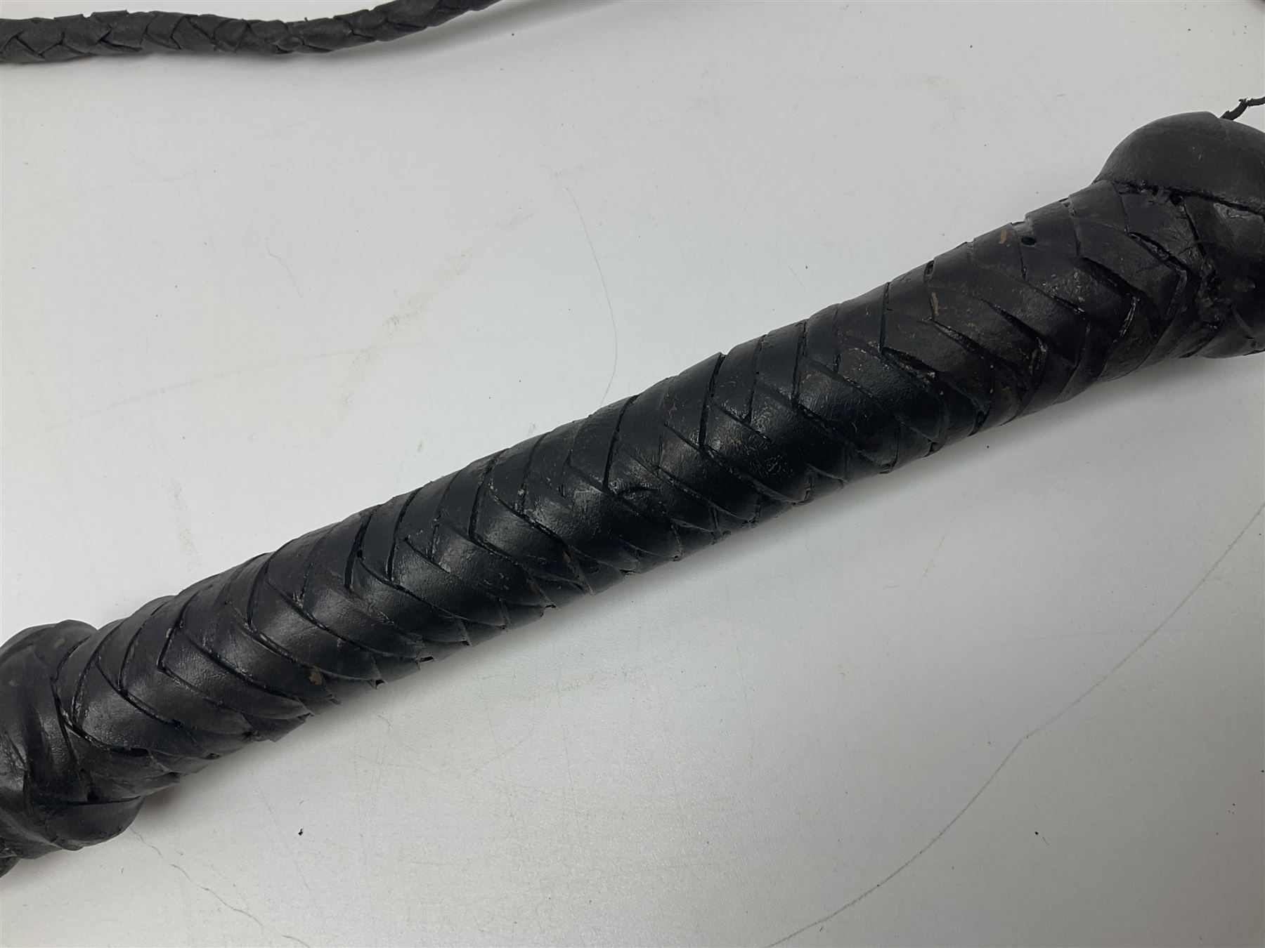 Near pair of short swords each with slightly curving 41cm fullered steel blade and all brass H-shaped hilt L52cm overall; plaited black leather whip; and reproduction pair of brass hilted swords, brass halberd blade and mace (7)