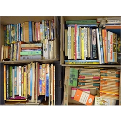  Large collection of early 20th century and later children's annuals, novels and publications including Alice in Wonderland, Rupert, Peter Pan etc, collection of 1950s Penguin books, paperback novels etc in eight boxes    