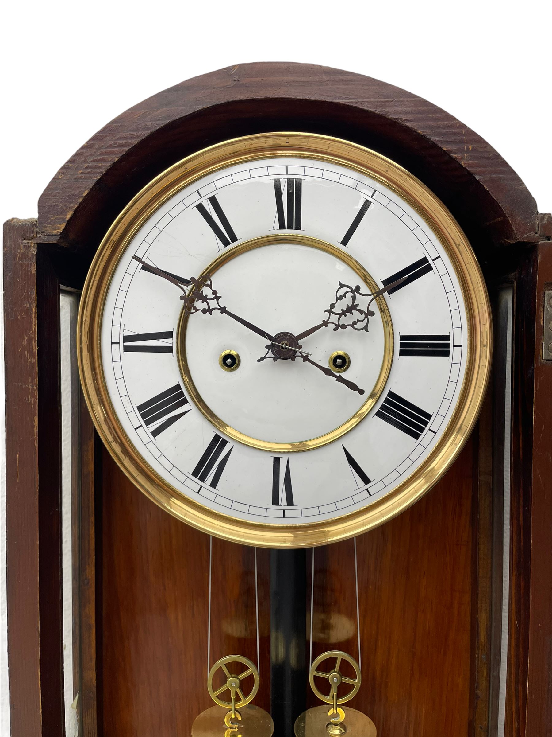 Lenzkirch – 8-day walnut cased weight driven Vienna regulator manufactured 1877-1878, with a break-arch pediment surmounted by a turned finial on a raised cavetto molding, fully glazed arched  door flanked by long ring turned pendants, flat base with open fretwork and two short pendants,  two piece enamel dial within a brass slip, Roman numerals, minute track and pierced steel hands, wooden pendulum with a brass faced bob, two brass cased weights and pulleys, dead beat escapement with a rack striking movement sounding the hours and half hours on a coiled gong, movement serial number 421410. 
Lenzkirch were one of Germanys most highly respected clock manufacturers of the 19th century, founded in the late 1850s the company produced movements and cases of high quality up until 1932.
