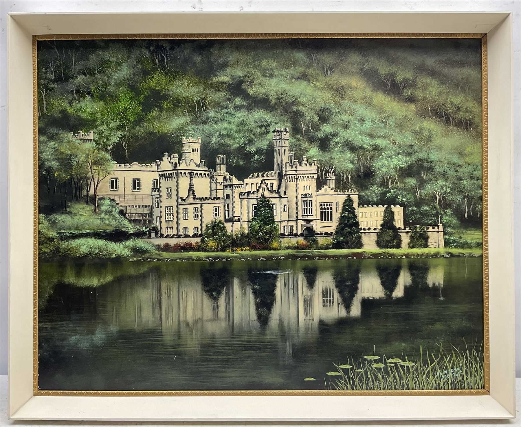 A J Wiseman (British 20th Century): Kylemore Abbey - Ireland, oil on board signed and dated 1967, 57cm x 73cm; English School (20th Century): Holne Bridge - Devon, oil on board unsigned, titled verso 28cm x 39cm (2)