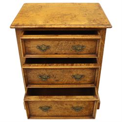 Small 20th century burr oak chest, the figured top over three graduated drawers with moulded fronts and pierced brass handles, on shaped feet
