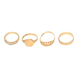 Four 9ct gold rings including cubic zirconia wishbone, all hallmarked