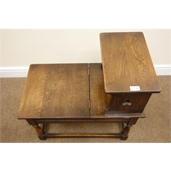  Early 20th century oak telephone table, hinged seat, turned supports joined by stretchers, W66cm, H66cm, D38cm  