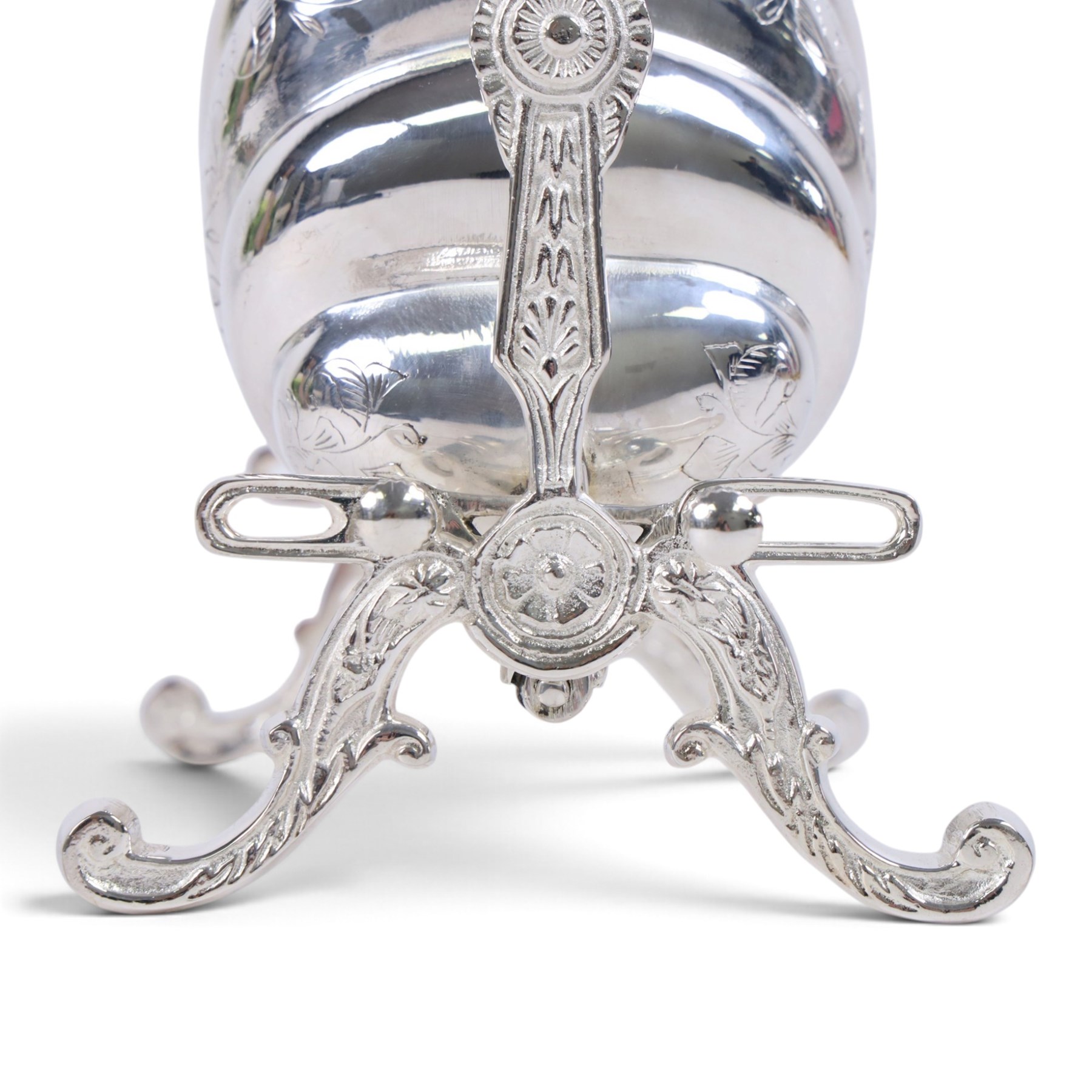 Silver-plated Victorian style biscuit box, in a shell form with engraved leaf detailing, upon scroll feet, H24cm