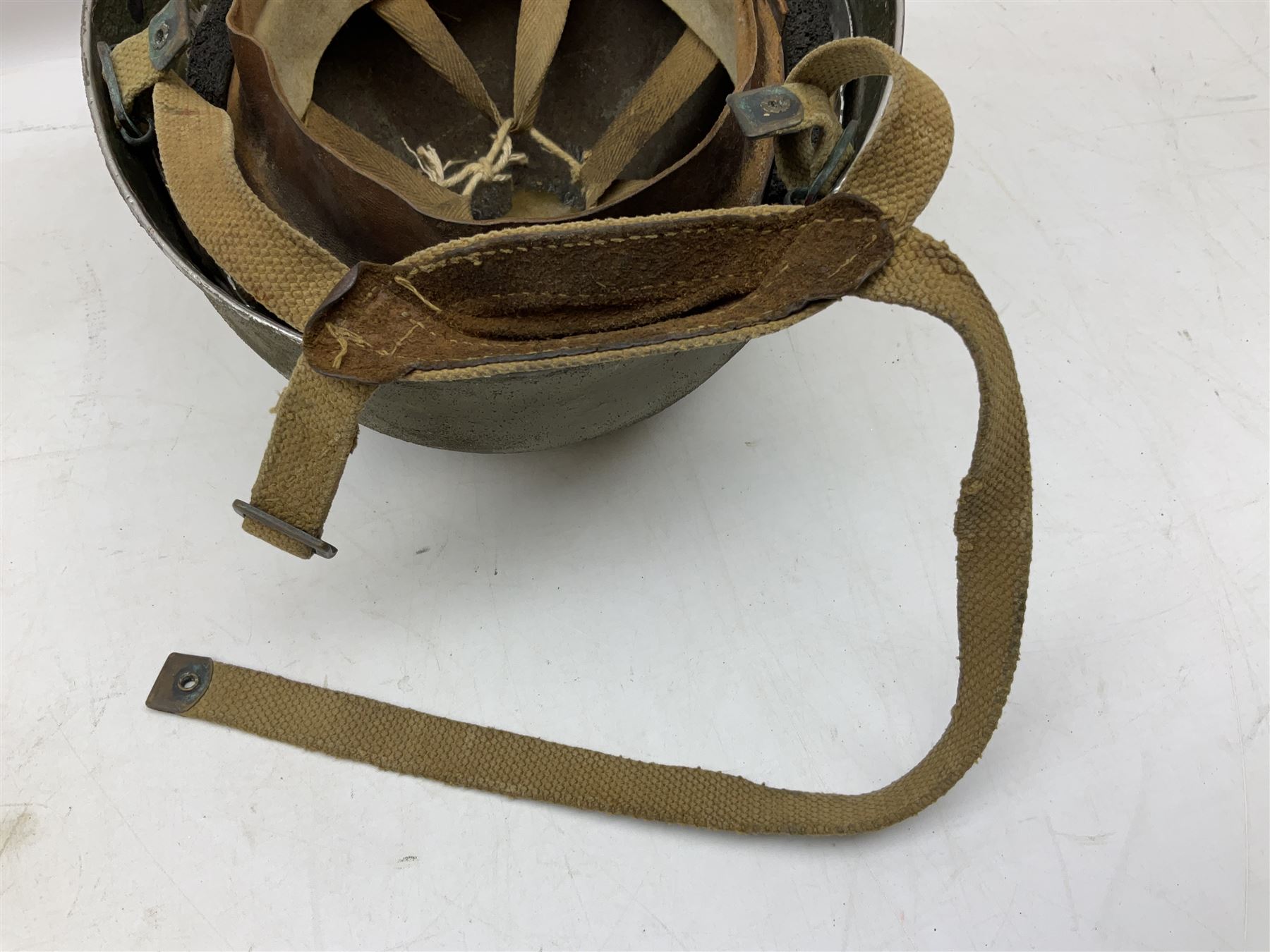 Post-WW2 British Airborne Troops,/Paratroopers Steel Helmet with green textured paint finish, leather and sponge liner and three point chinstrap mounting; liner marked BMB II 1953 71/4